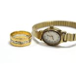 A gold & platinum band comprised of a narrow engraved platinum band fused between two engraved