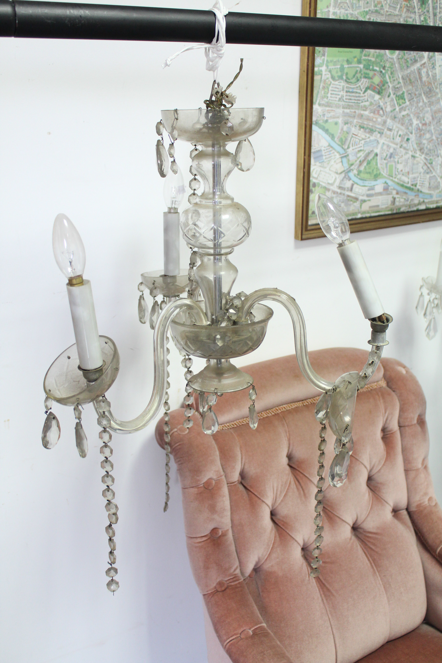 A cut glass chandelier with eight scroll arms with pendant prism drops, the slender baluster - Image 5 of 5