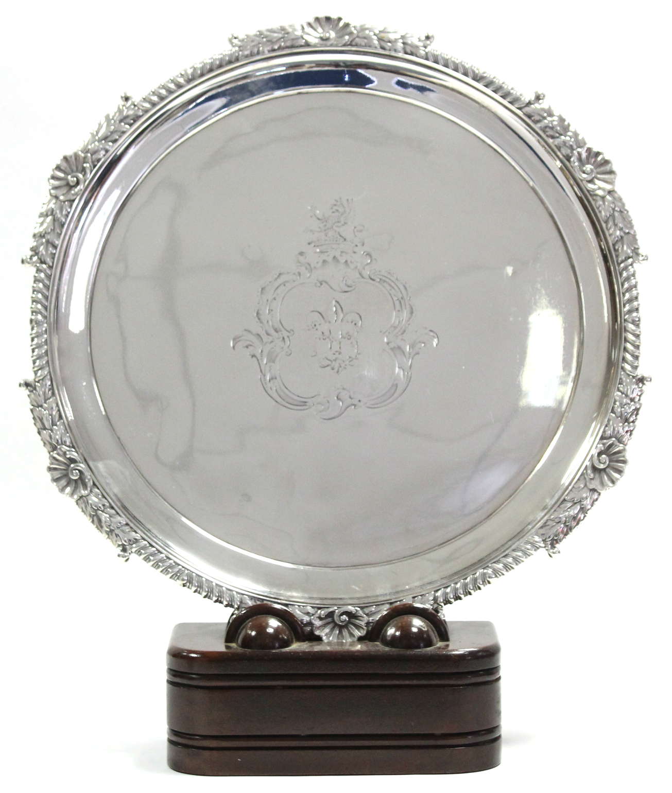 A GEORGE III CIRCULAR SALVER with gadrooned shell & leaf-scroll border, engraved armorial to the