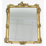 A 19th century rectangular wall mirror in foliate decorated giltwood frame; 22" x 27".