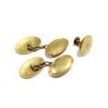 A pair of 18ct. gold cuff-links with oval panels (7.9gm); & a 15ct. gold shirt stud (1.2gm).