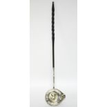 An 18th century punch ladle, the round single-lipped bowl inset Queen Anne medal commemorating the