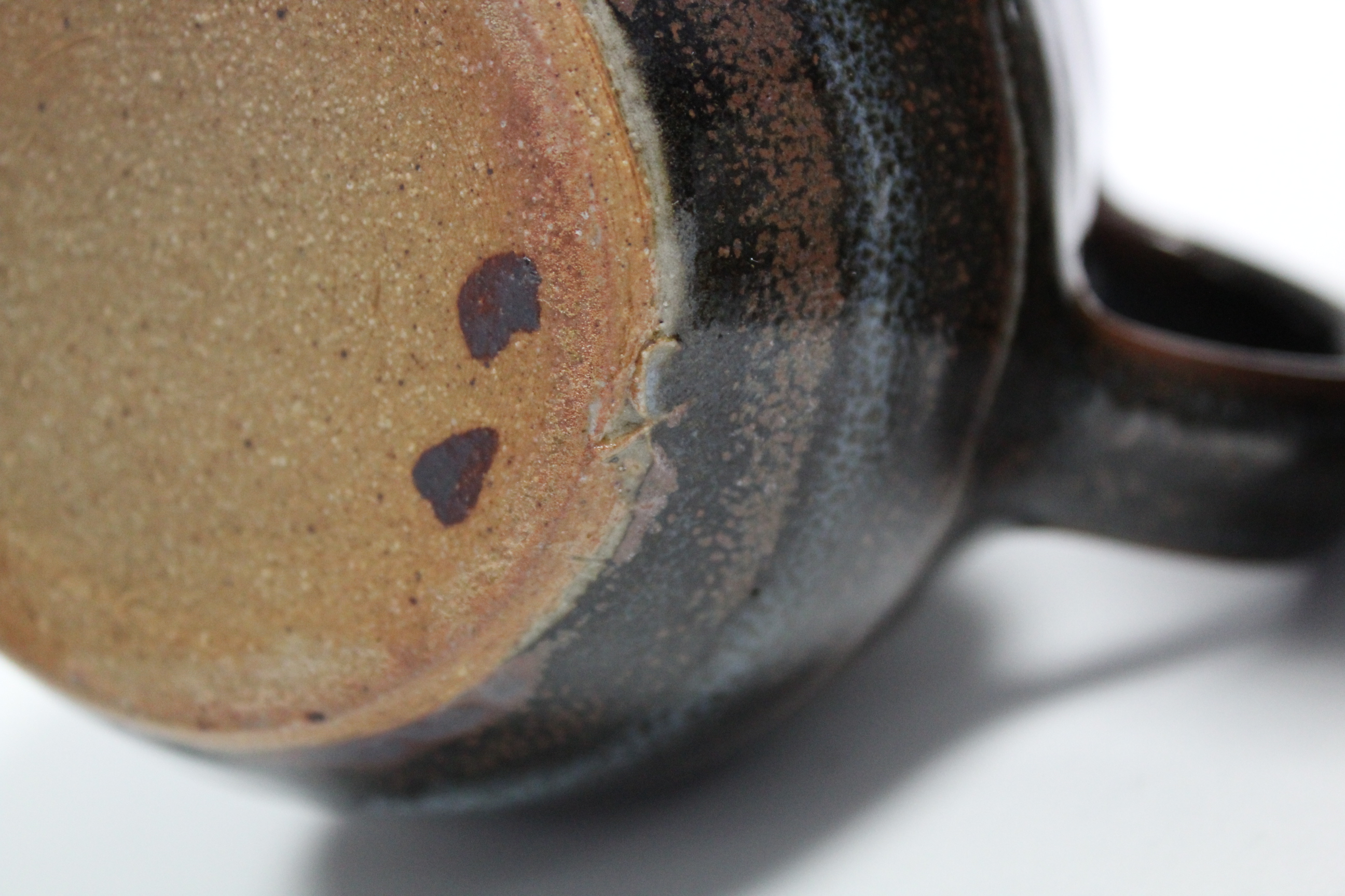 A St Ives studio pottery 4.5“ bulbous jug of speckled blue over chocolate brown glaze with waved - Image 3 of 4