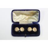 A pair of 15ct. gold cuff-links with circular planished panels, each centred by a small diamond. (