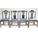 A matched set of four late 18th century dining chairs, comprising a pair of Chippendale-style chairs