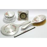 A four-piece dressing table set with guilloche enamel decoration of pink flowers on a pearl
