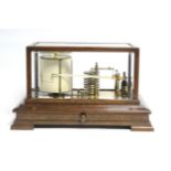 A late 19th/early 20th century barograph in oak case with bevelled glass to top & all sides, chart