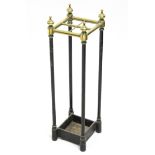 A Victorian cast-iron & brass four-division umbrella stand; 7½" x 25".