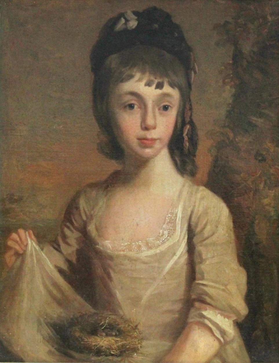 ENGLISH SCHOOL, late 18th century. A half-length portrait of a girl holding a bird’s nest & eggs