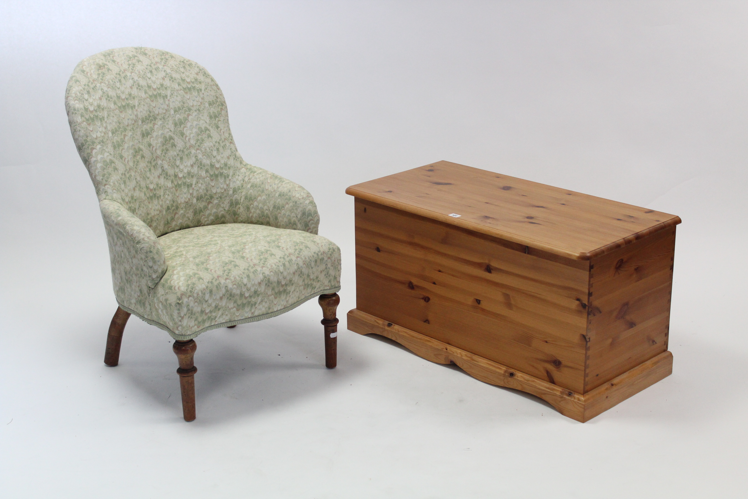 A pine blanket box with hinged lift-lid, & on shaped plinth base, 35¼” wide; & a Victorian nursing