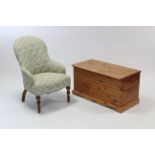 A pine blanket box with hinged lift-lid, & on shaped plinth base, 35¼” wide; & a Victorian nursing