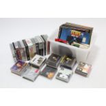 Approximately eighty various Elvis Presley records, CDs, DVDs, & video cassettes.