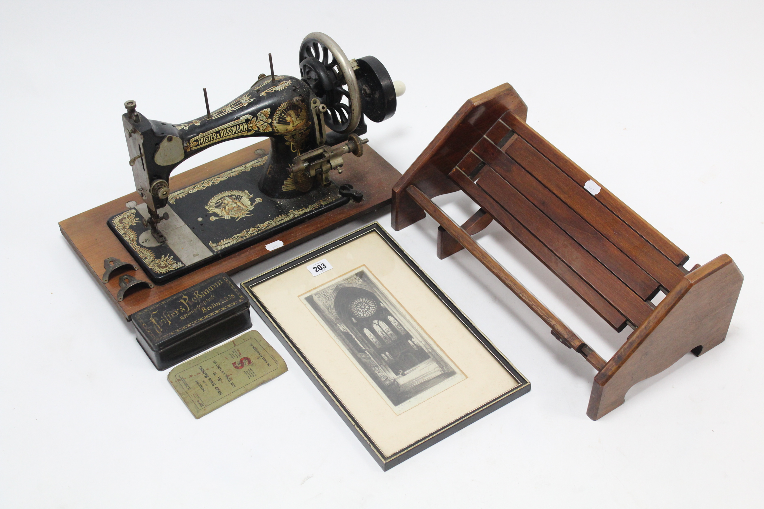 A Frister & Rossman hand sewing machine (lacking case); a black & white etching by Charles A.
