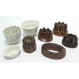 Five Victorian copper oval jelly moulds; & two Victorian white glazed ceramic jelly moulds, part w.