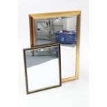 A gilt frame rectangular wall mirror inset bevelled plate, 32” x 23”; & an ebonised frame
