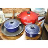 Four various Le Creuset cooking pans.