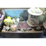 Two mantel clocks; three oil lamps; a birdcage; & sundry other items.