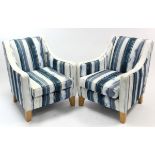 A pair of Multiyork easy chairs upholstered blue/grey & white material, & on short, square tapered
