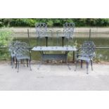 A cast-metal patio table with rectangular top, & on four shaped legs, 62” x 35”; & a ditto set of