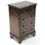 A reproduction inlaid-mahogany small chest fitted four long drawers with brass ring handles, & on