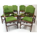 A set of six oak dining chairs (including a pair of carvers), each with padded seats & backs