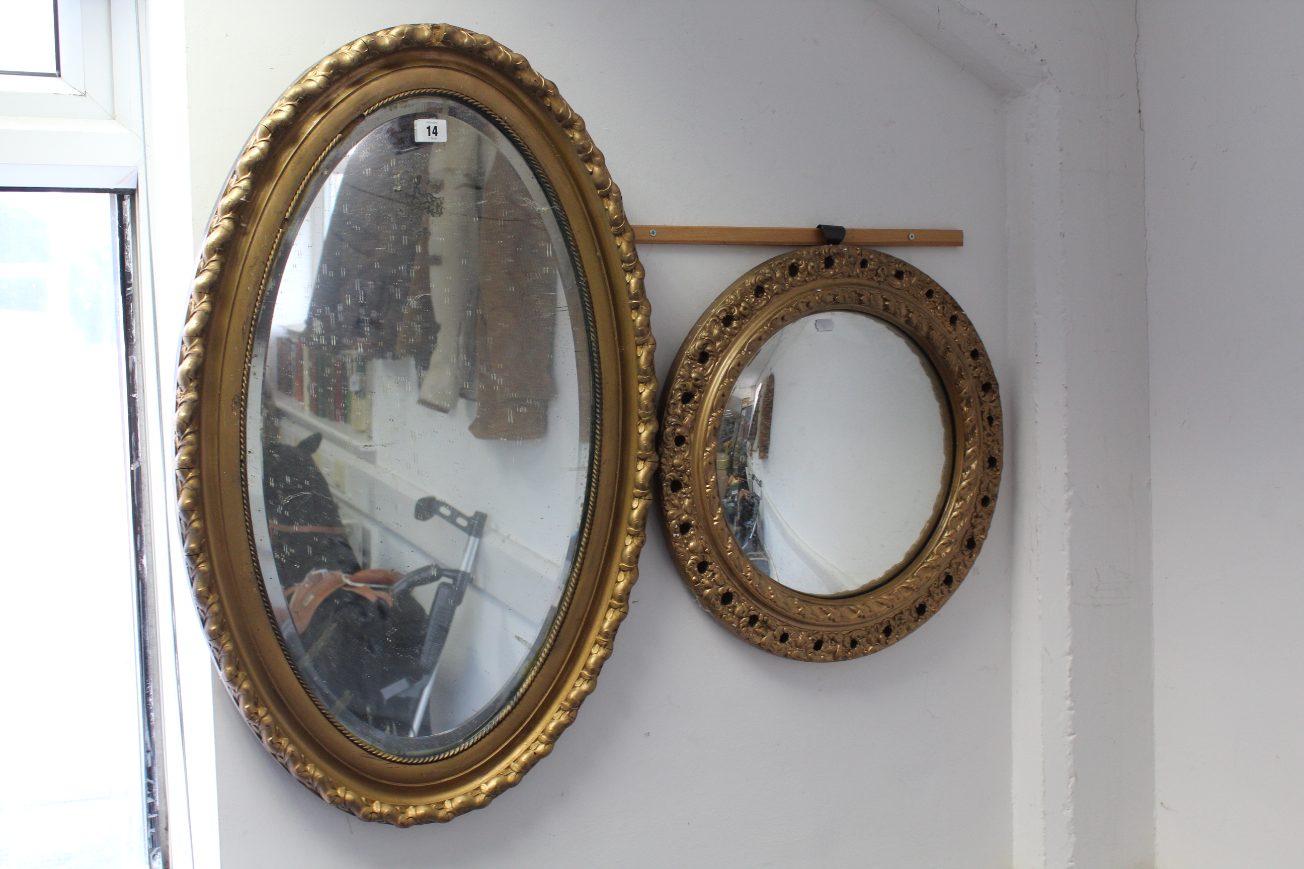 A gilt frame oval wall mirror inset bevelled plate, 32” x 20”; & a gilt frame convex wall mirror,