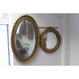 A gilt frame oval wall mirror inset bevelled plate, 32” x 20”; & a gilt frame convex wall mirror,