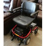 A Roma “Reno” electrically-operated wheelchair (requires a new charger).