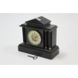 A 19th century mantel timepiece in black slate architectural-style case, 11” high.