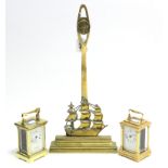 A brass door porter, 18¼” high; & two modern carriage clocks, one w.a.f.