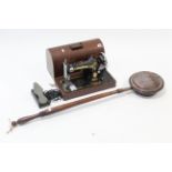 A Singer electric sewing machine with carrying case, w.o. & a 19th century copper engraved warming