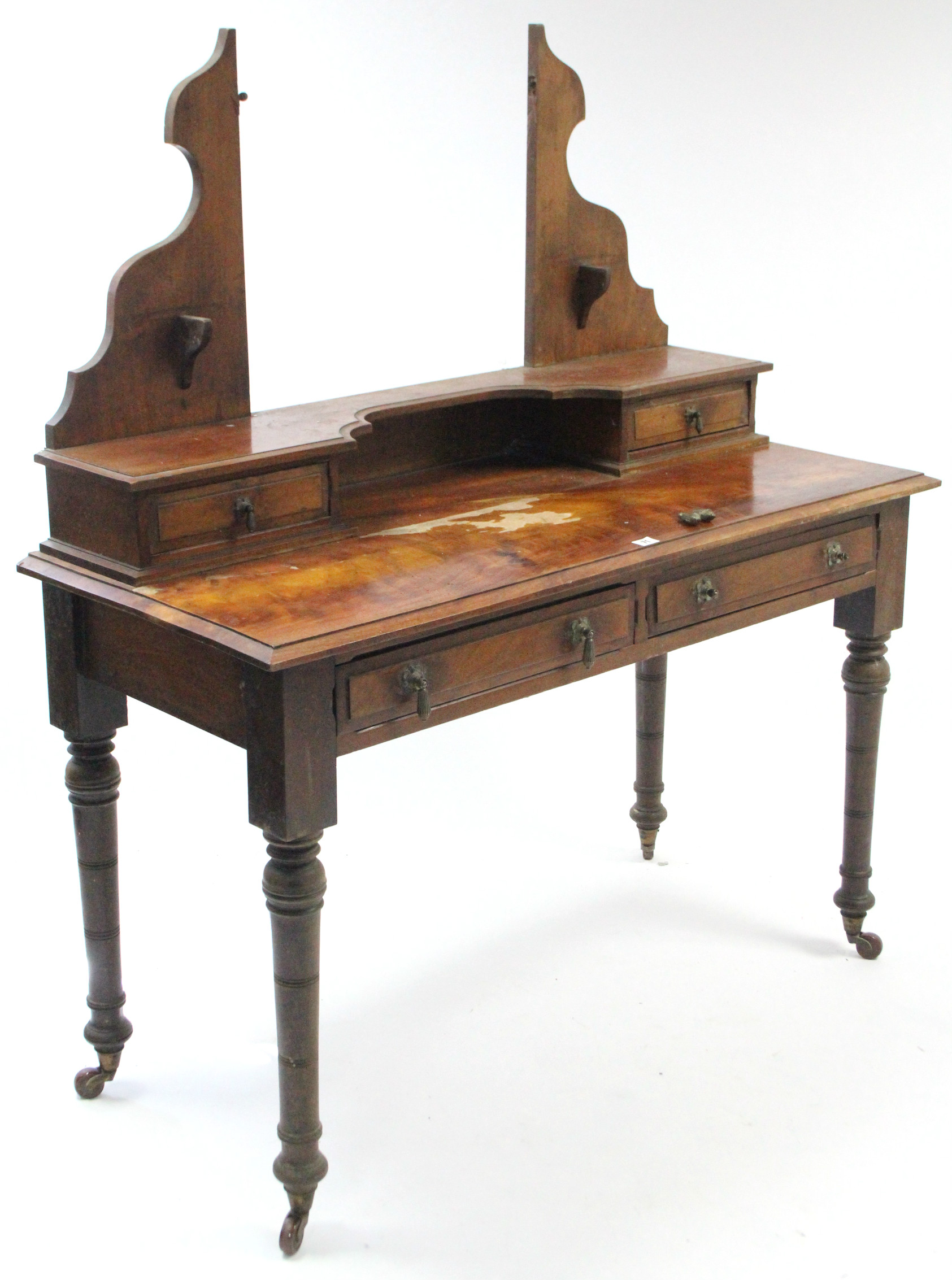 A late Victorian mahogany dressing table (lacking mirror) fitted two frieze drawers, & on ring-