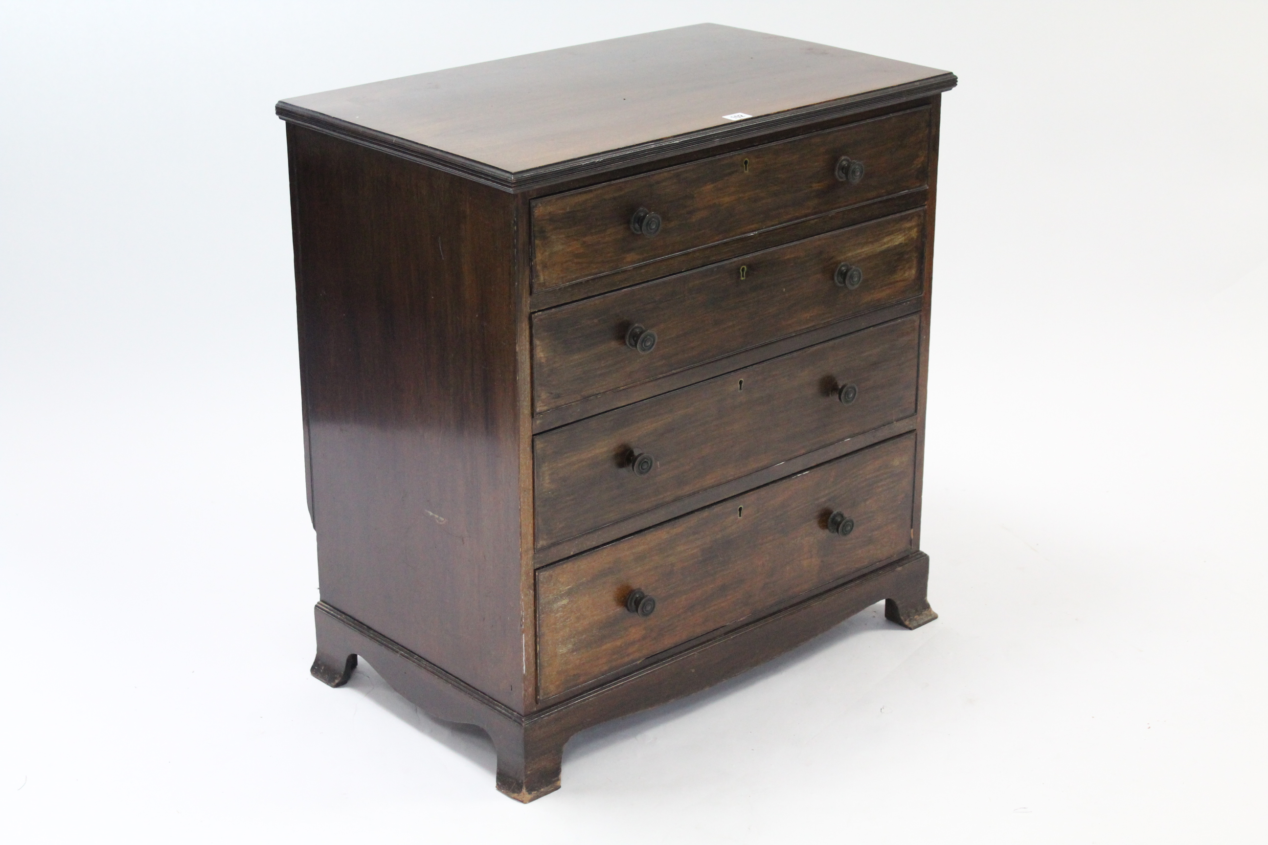 A Georgian-style small mahogany chest fitted four long graduated drawers with brass knob