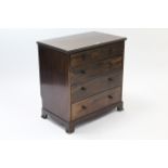 A Georgian-style small mahogany chest fitted four long graduated drawers with brass knob