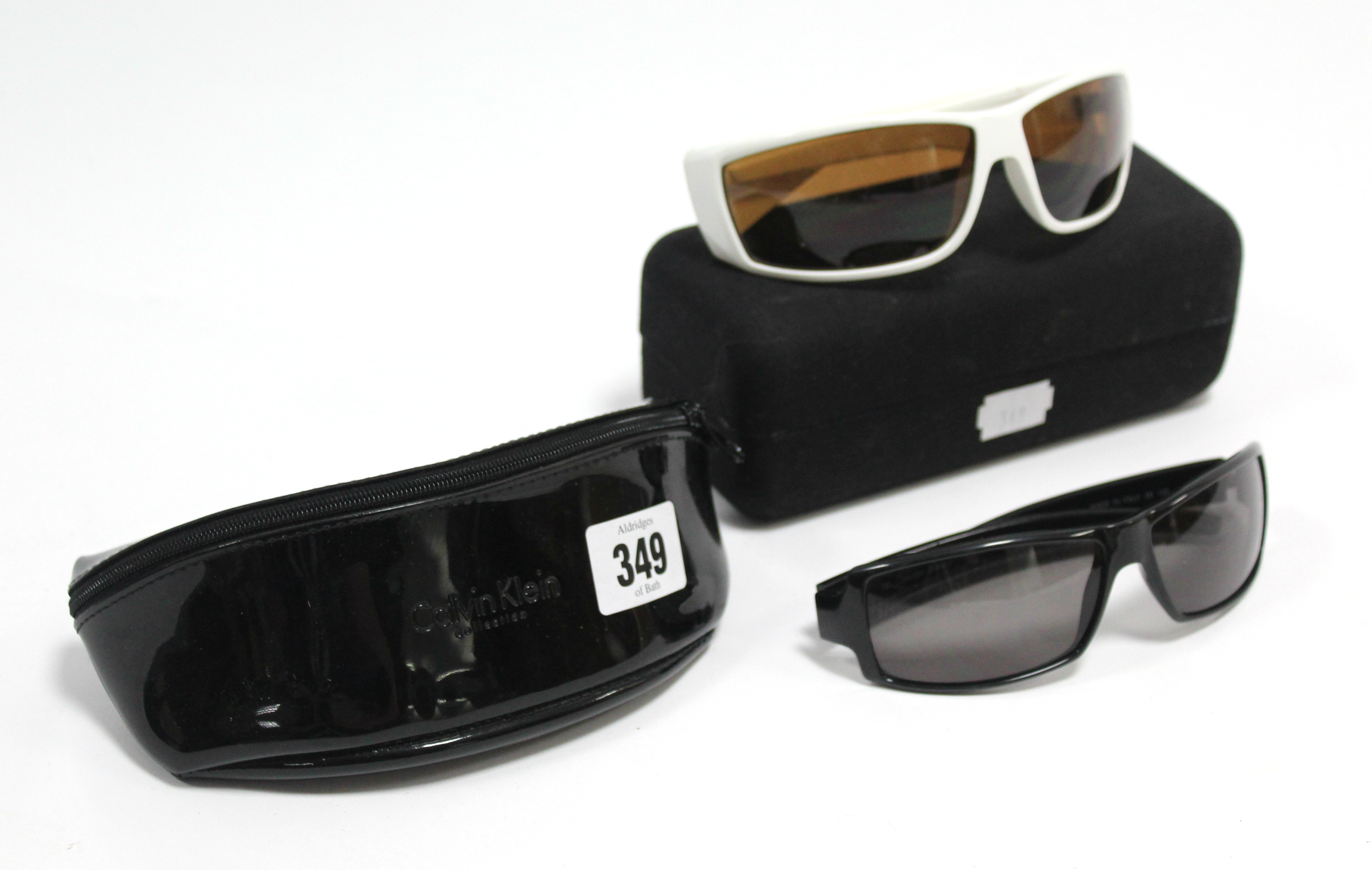 A pair of Calvin Klein sunglasses; & a pair of Bulsun sun glasses, each with case.