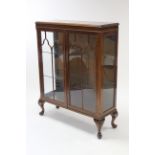 A mahogany china display cabinet fitted two plate-glass shelves enclosed by pair of glazed doors,