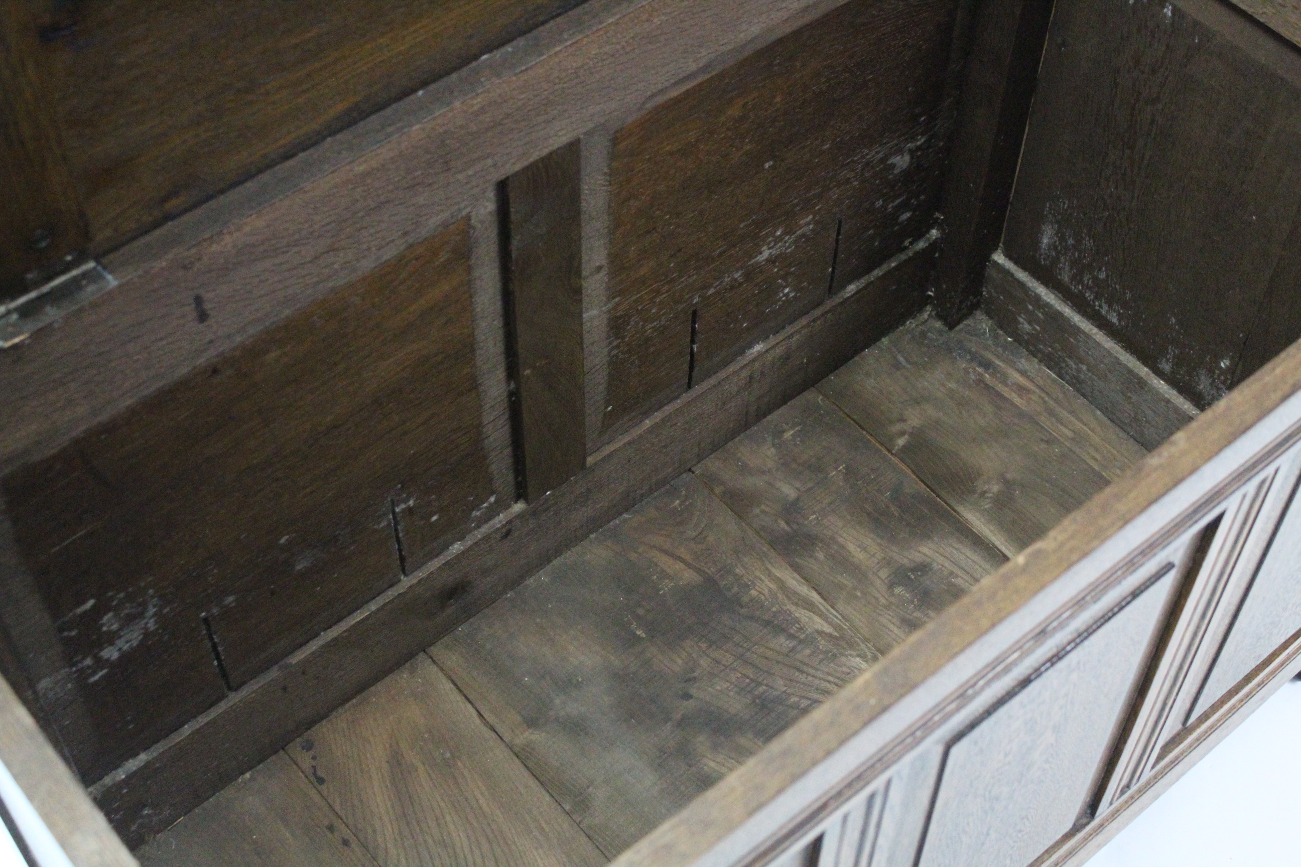 An oak coffer with hinged lift-lid, & with panelled front & sides, 37” long. - Image 3 of 3