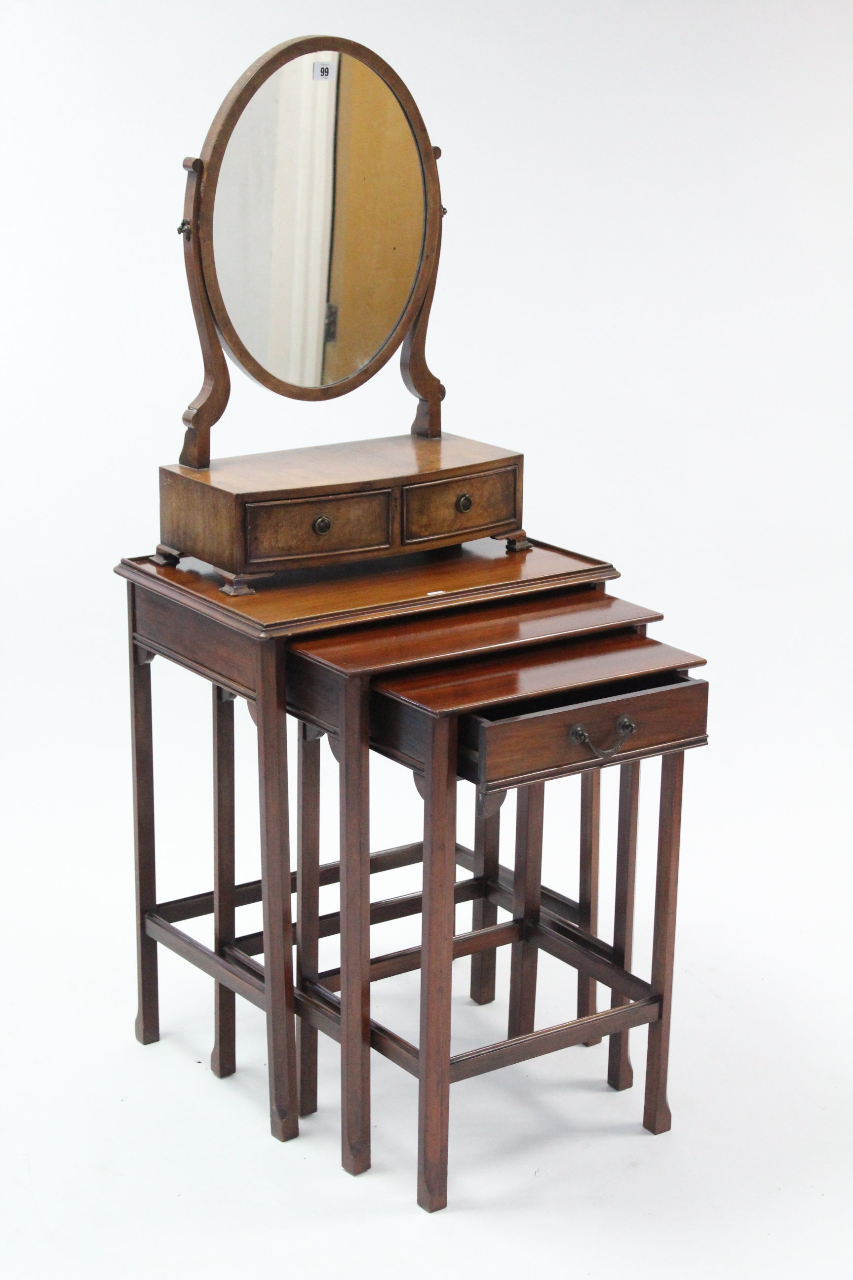 A mahogany oval swing toilet mirror fitted two drawers to the bow-front box base, 25½” high; & a
