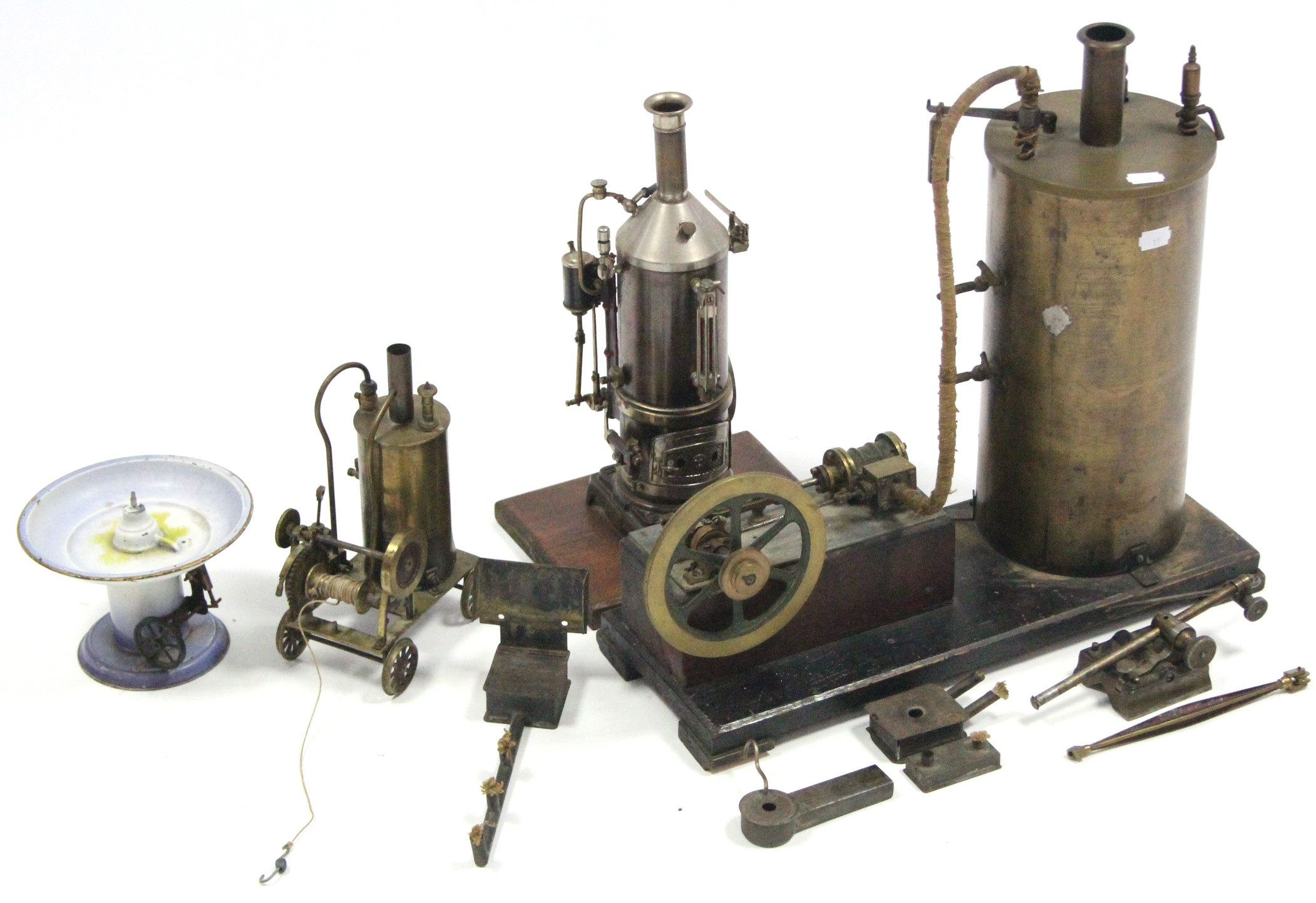 A brass scratch-built stationary steam engine, 16¾” high; & two similar smaller ditto.