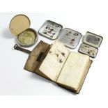 A leather wallet containing various fishing lures; two tins of fishing lures; & an aluminium tin