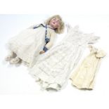 A late 19th/early 20th century large bisque head girl doll (15) with blue sleeping eyes, open mouth,