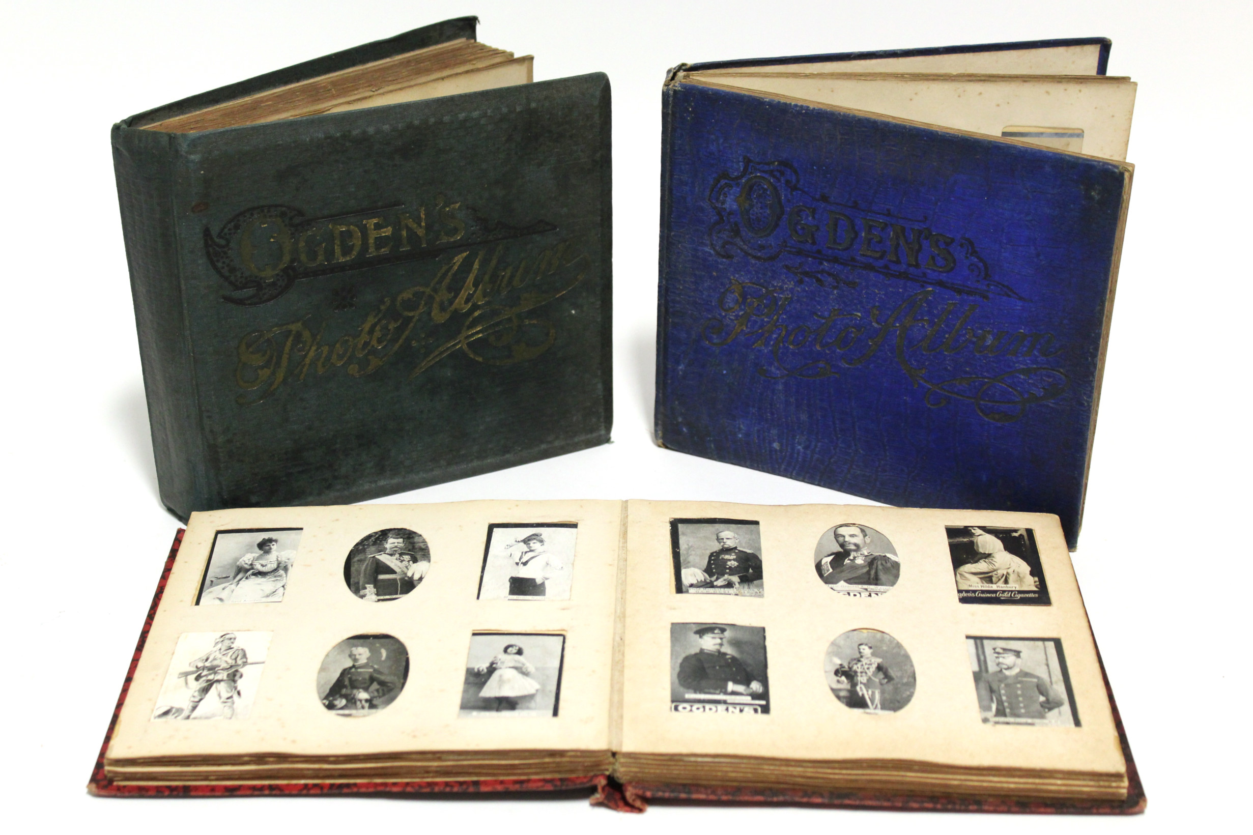 Three Ogdens photo albums containing numerous Ogdens cigarette cards.