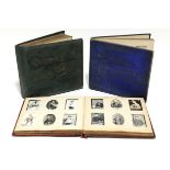 Three Ogdens photo albums containing numerous Ogdens cigarette cards.