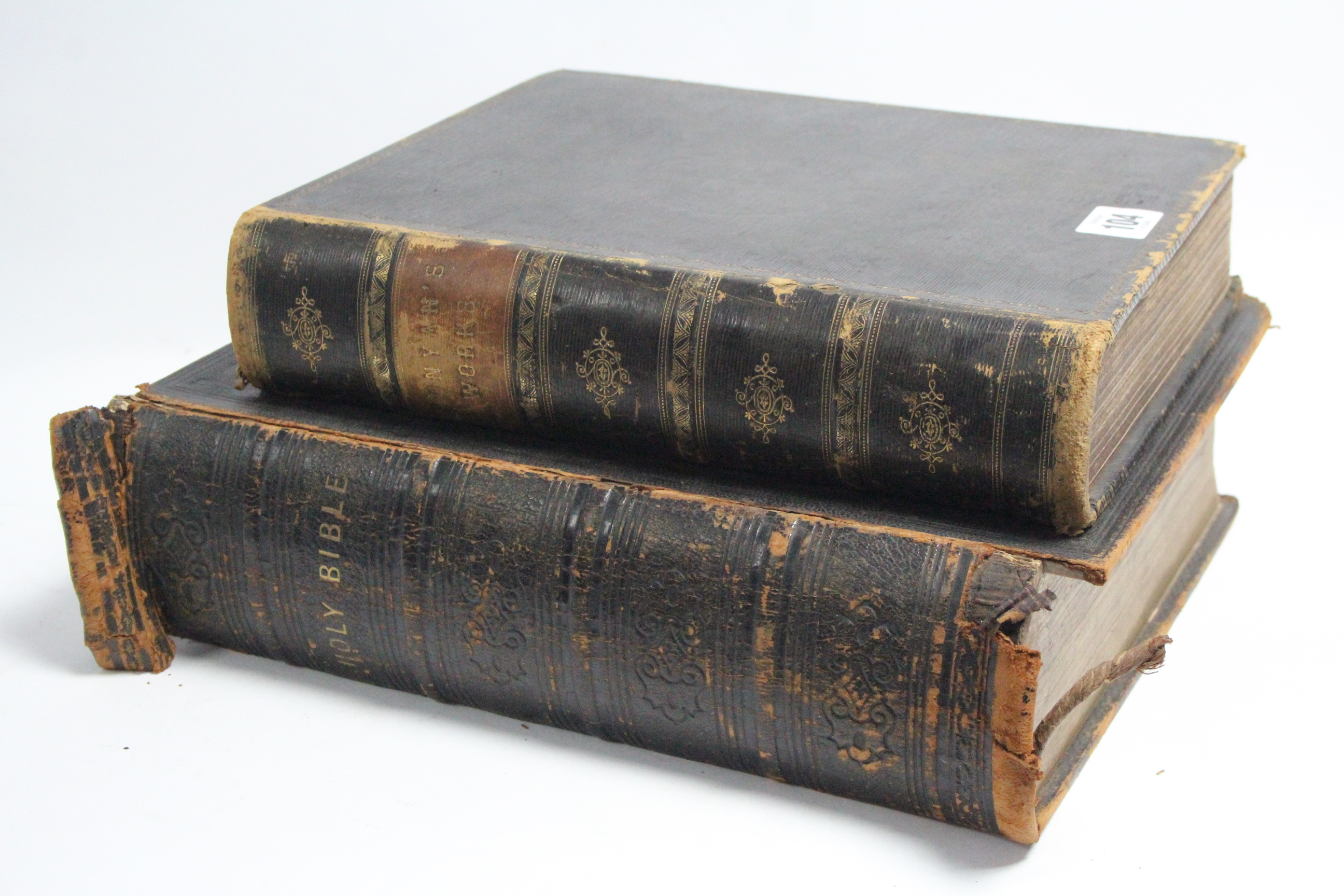 A mid-19th century Holy Bible printed by Eyre & Spottiswoode; & a leather-bound volume “The