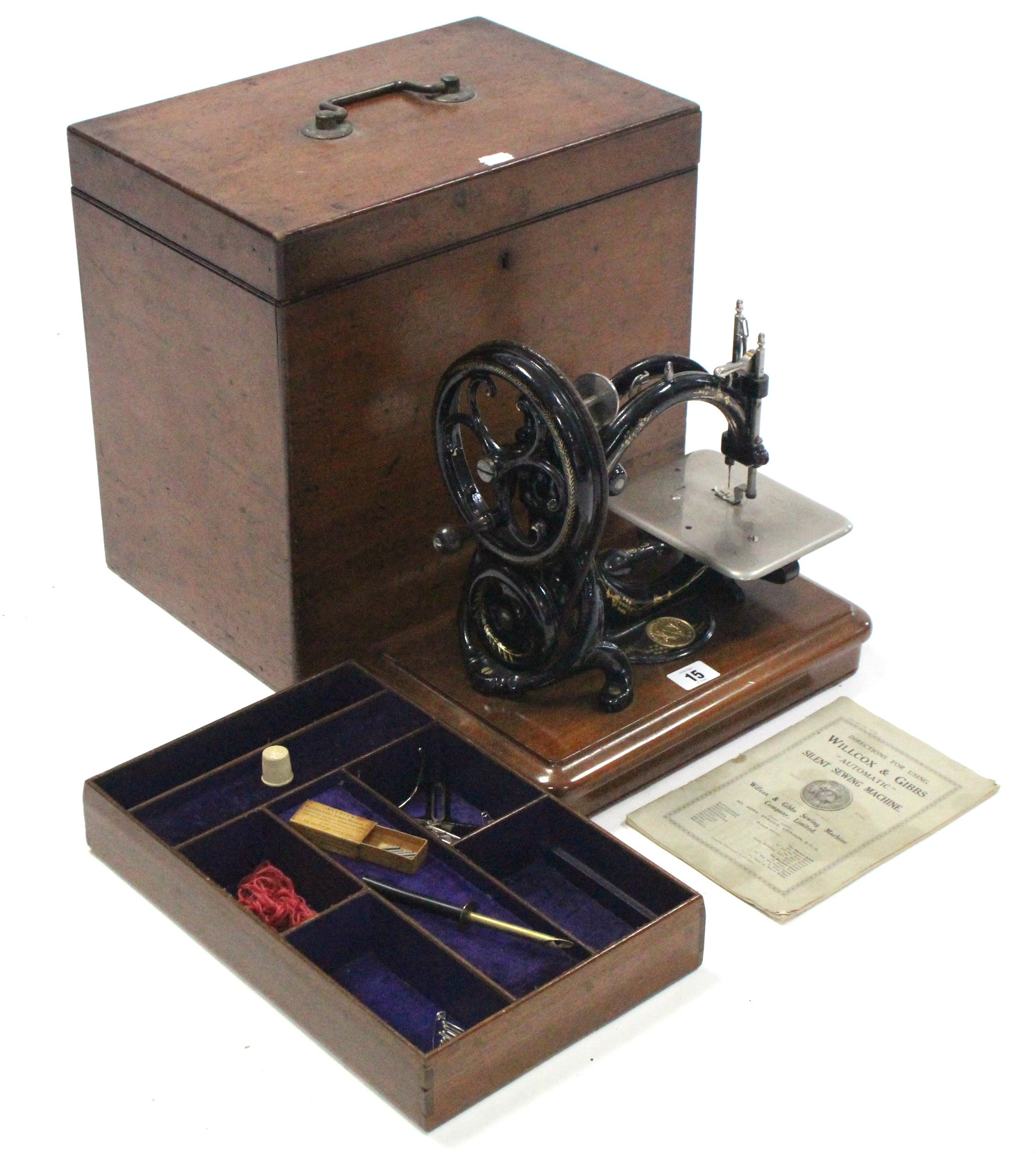 A Willcox & Gibbs “Automatic” silent sewing machine, in fitted mahogany case.