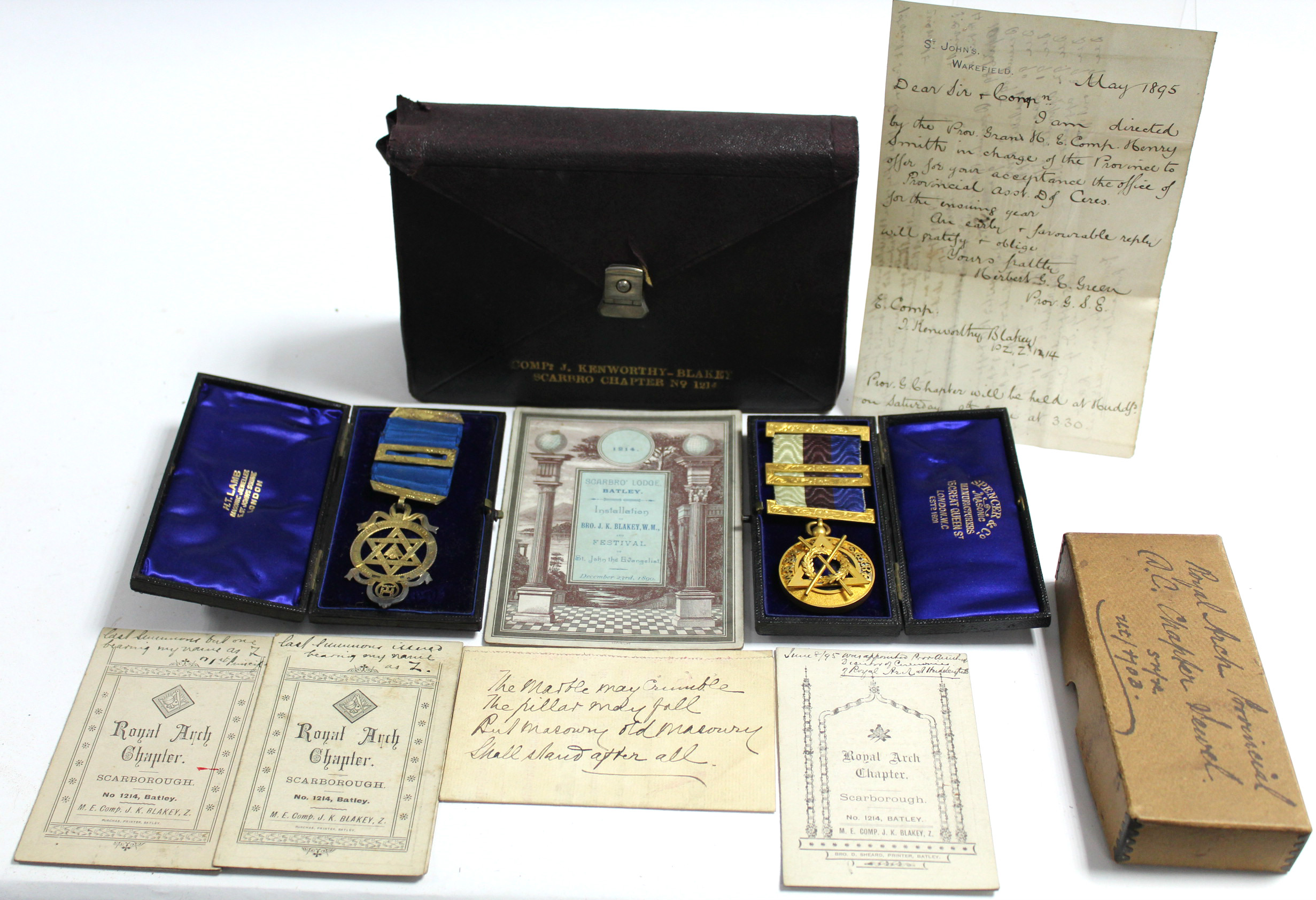A gilded silver Masonic regalia medal; a gilt-metal ditto; a Masonic regalia leather pouch; &