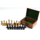 A set of treen chessmen of natural & ebonised stain (size of Kings 2¾” high, slight faults), in