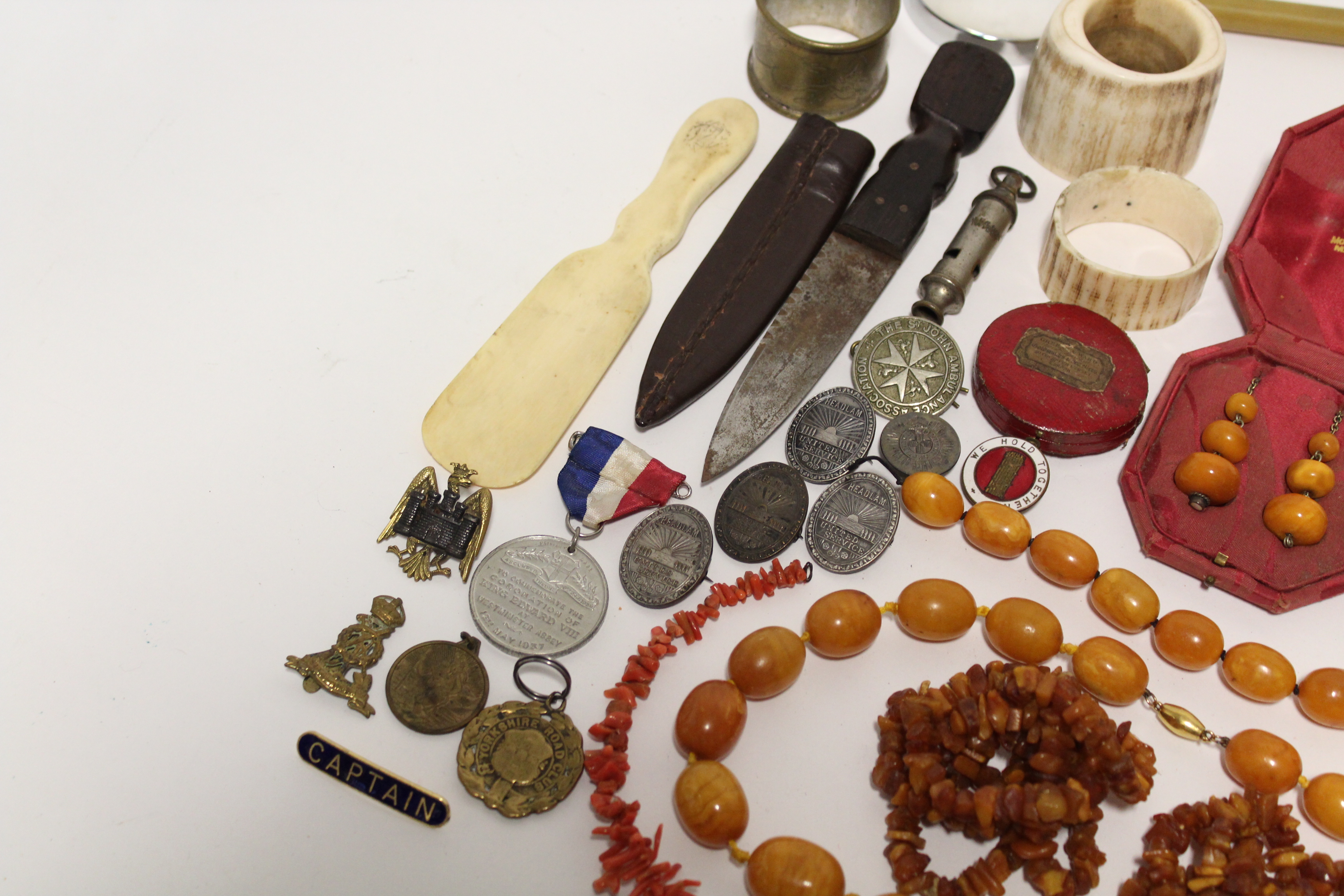 A small hunting knife with leather sheath; two whistles; a bone shoehorn; various badges; a small - Image 4 of 5