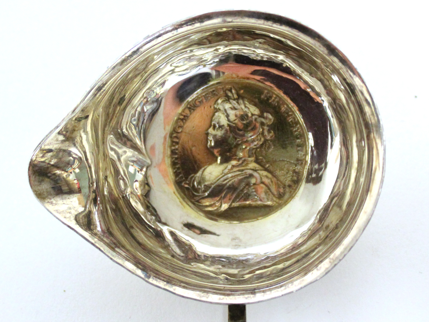 An 18th century punch ladle, the round single-lipped bowl inset Queen Anne medal commemorating the - Image 2 of 4