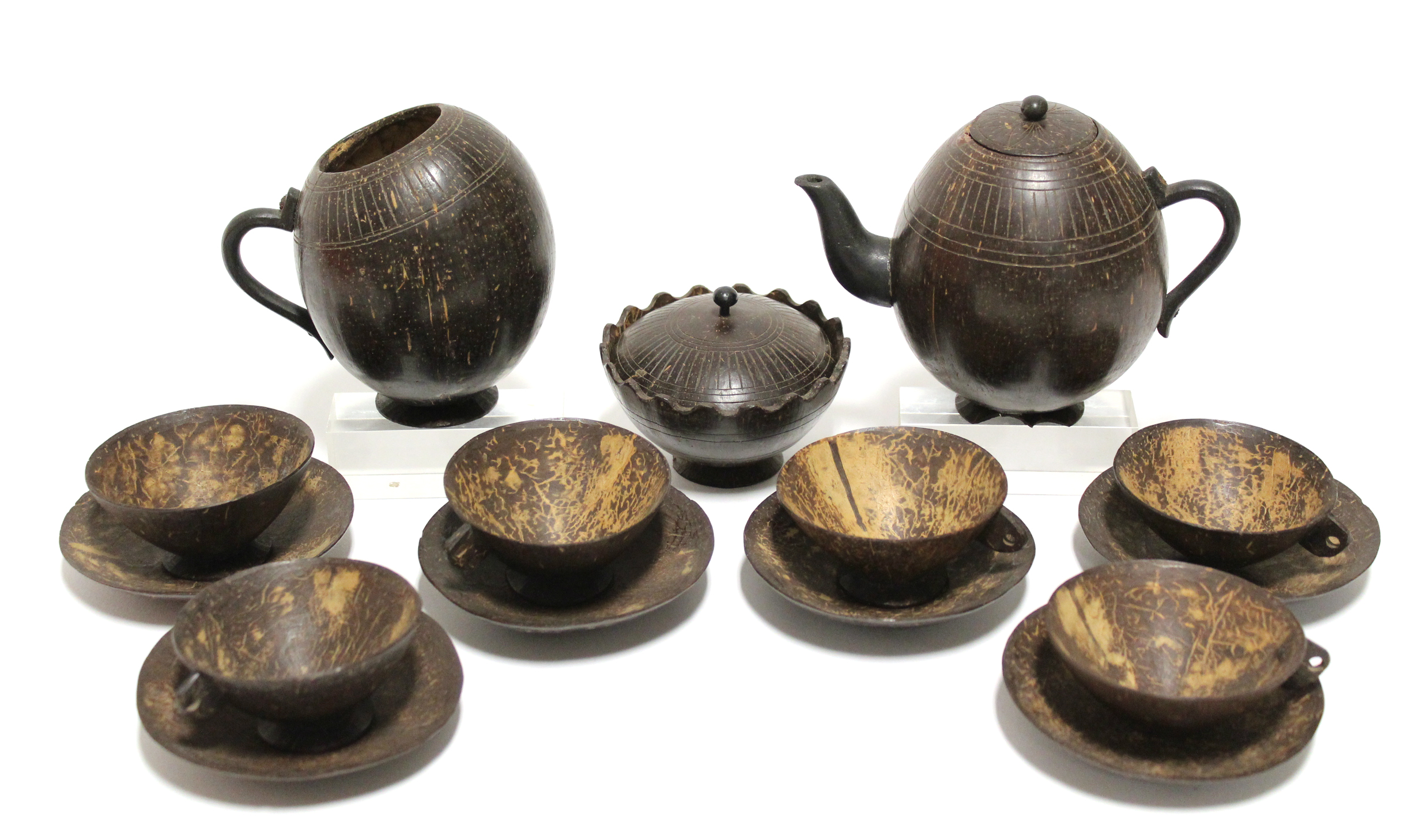 A 1920’s Sri Lankan carved coconut shell fifteen piece tea service (settings for six), part w.a.f.